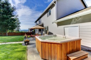 Adding a hot tub to your home may not increase its value, but it could offer worthwhile benefits